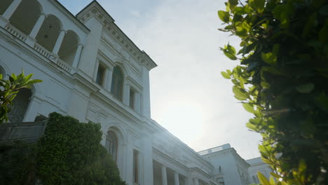 white palace exterior with garden