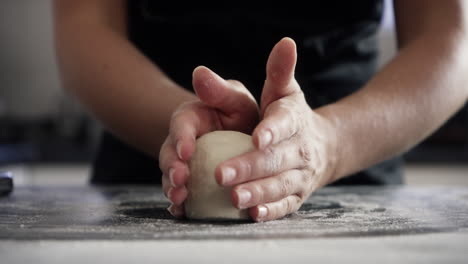 woman kneading dough