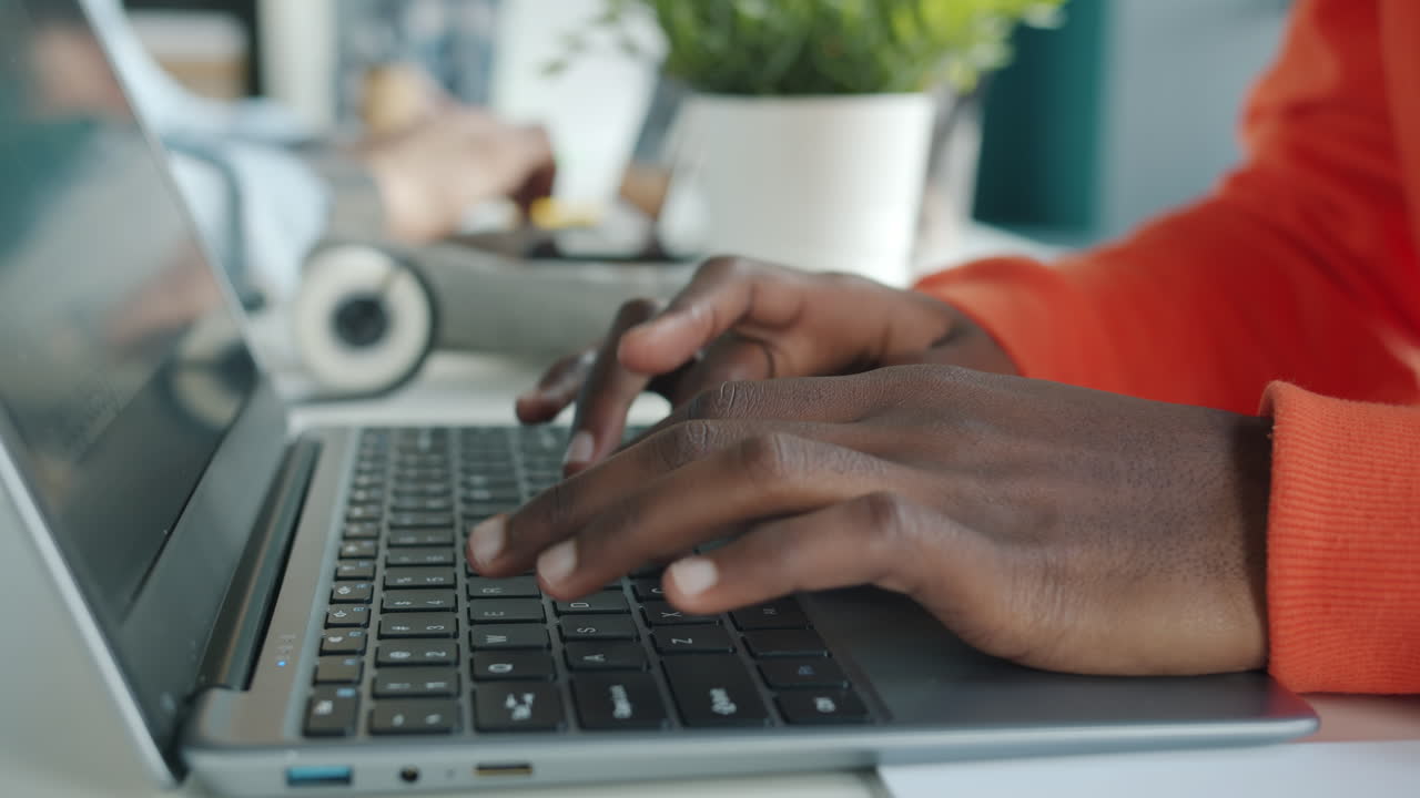 Person Typing on a Laptop
