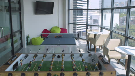 Tilt-Down-Shot-Of-A-Bright-Modern-Empty-Office---Game-Room