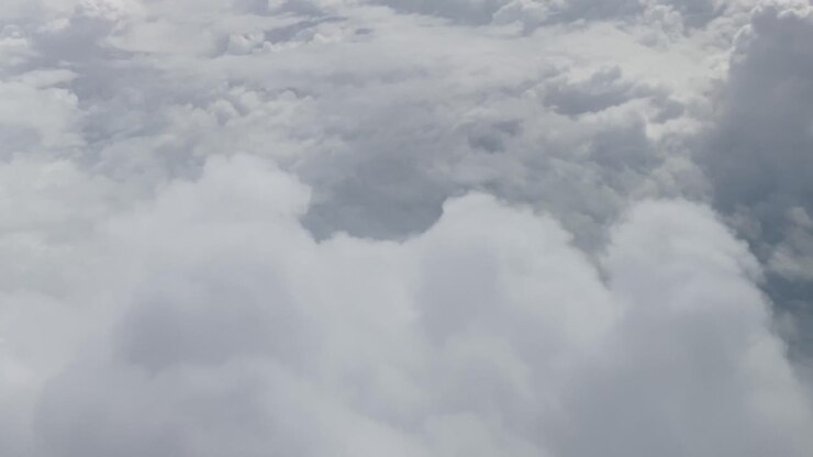 Commercial passenger jet planes fly thru clouds. Cloudscape