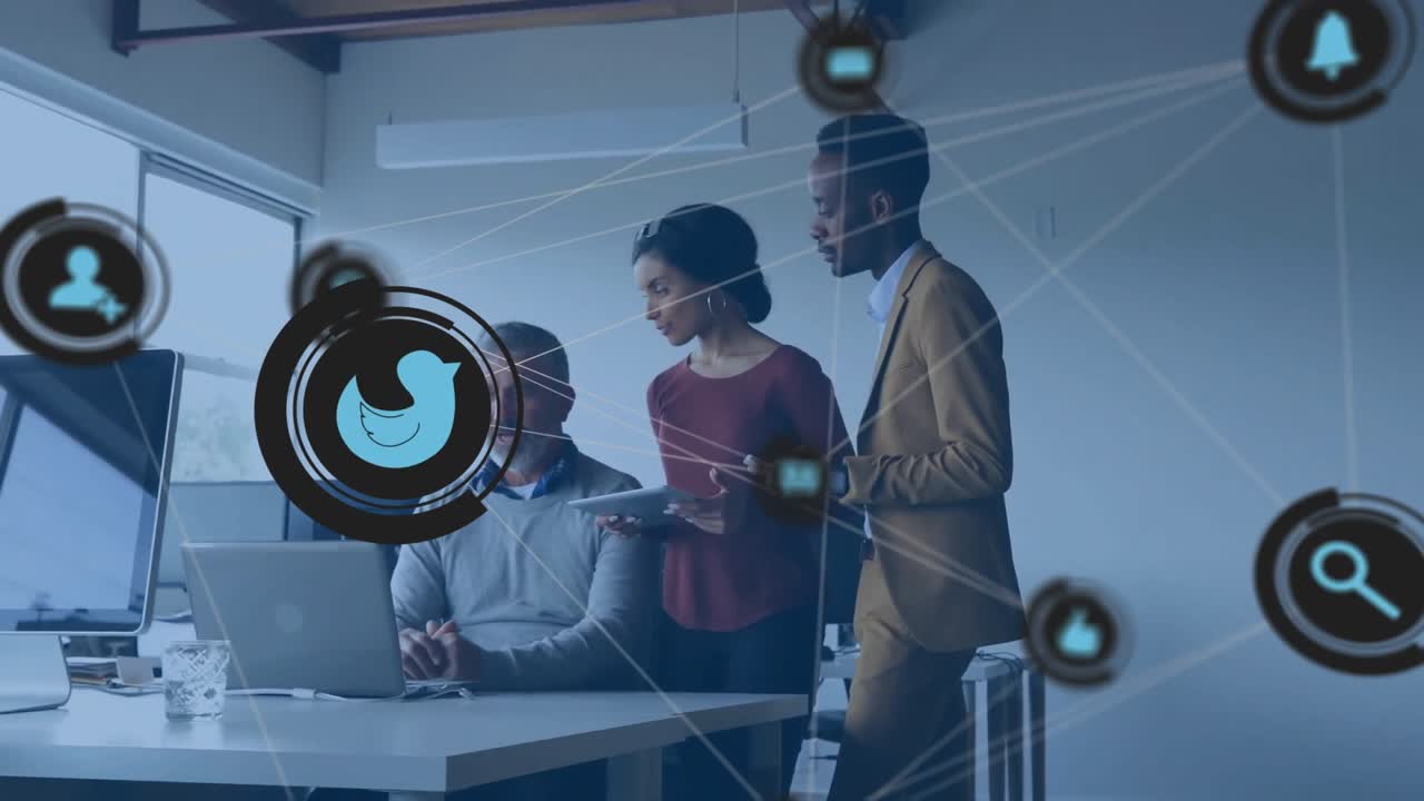 Team reviewing marketing data as network overlay animating social media icons appearing over laptop