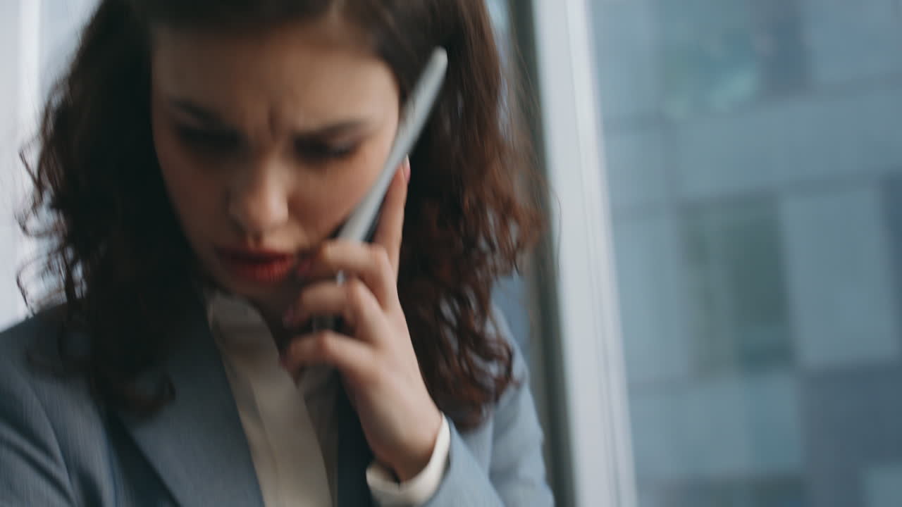 Annoyed business lady calling at modern workplace close up. Woman looking papers