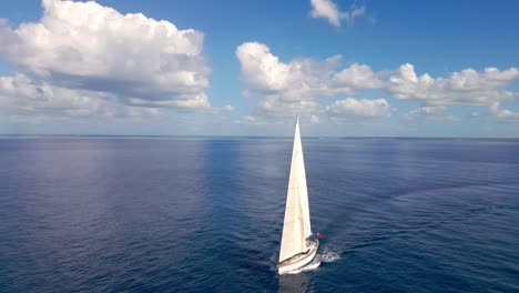 Luxury-white-Oyster-82-yacht-sailing-on-blue-ocean-water