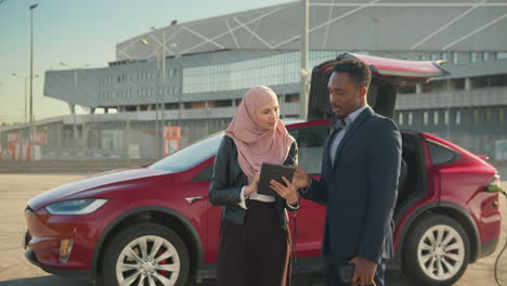 business people discussing an ev charging session