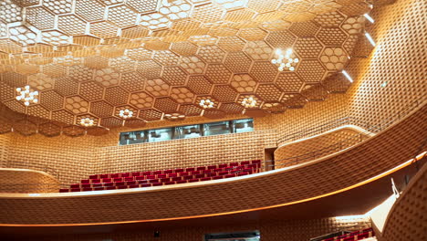 pan over the complex sound treatment architecture in the auditorium of the seine musicale in paris, france