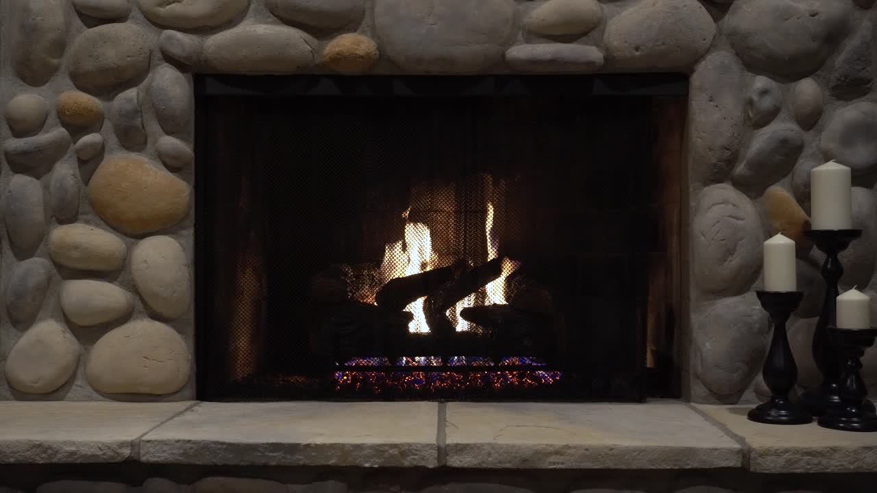 Cozy Fireplace with Stone Surround and Candles