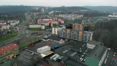 Flying-over-buildings-in-Gothenburg-on-cloudy-day