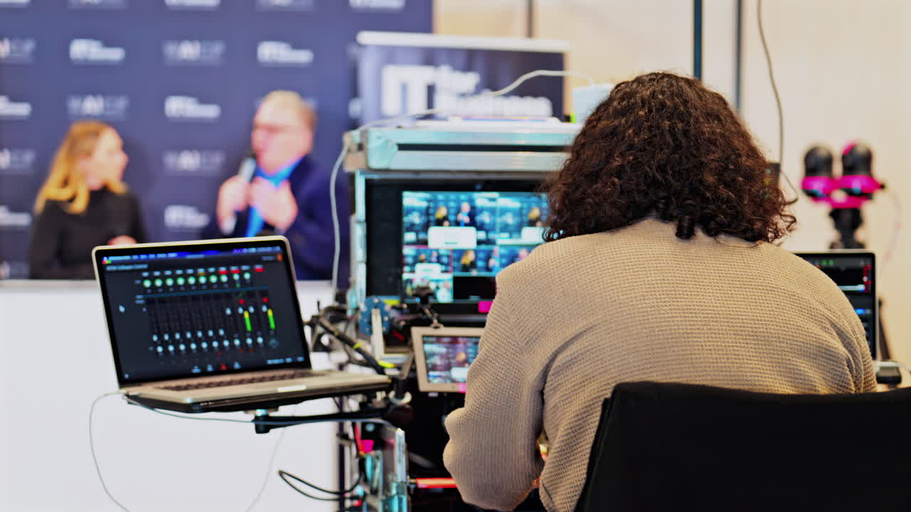 Cannes, France - February 15, 2025: Behind-the-scenes look of media production with professional equipment at a conference