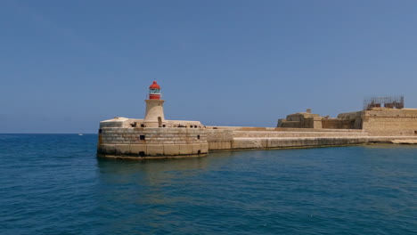 sailing past the saint elmo breakwater and the small lighthouse on the tip