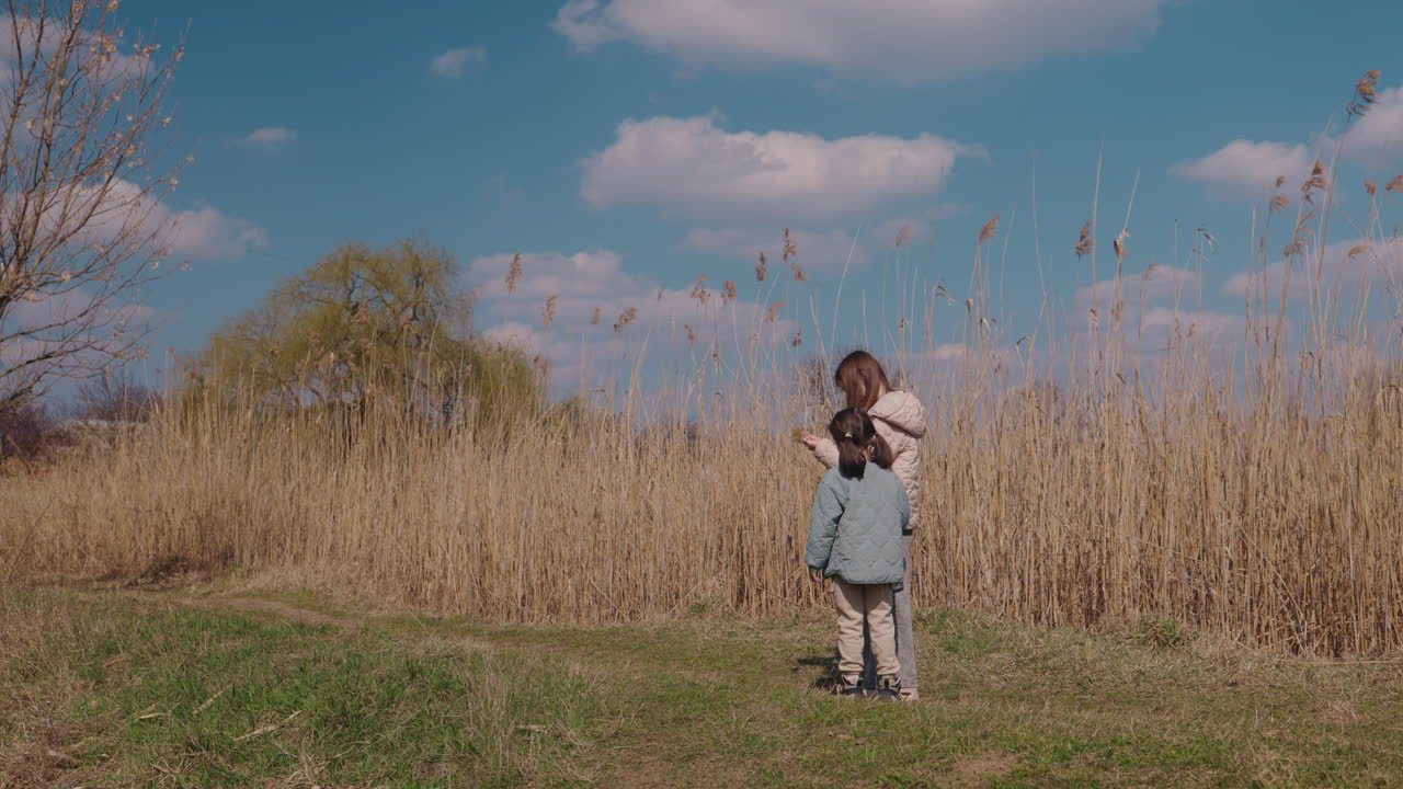 Two Girls Exploring a Field