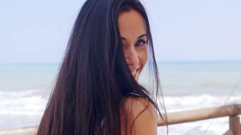 Happy-Young-Woman-at-the-Beach-with-a-Toothy-Smile