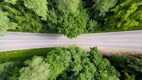 Cars-a-driving-at-a-street-shown-from-above-with-a-valley-effect-caused-by-lens-distortion