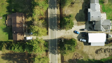 Aerial-shot-of-rural-country-road-in-beautiful-tree-lined-neighborhood