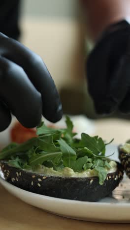 chef preparing avocado toast sandwiches