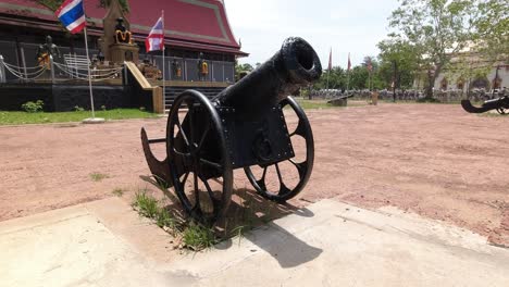 ancient cannon at the entrance of wat bang kung temple in thailand