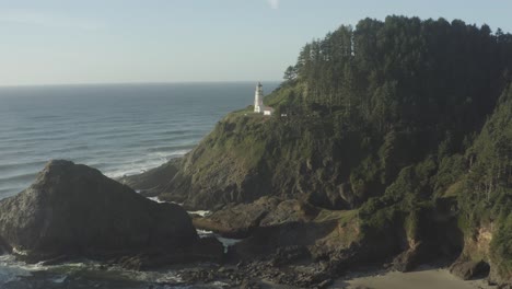 wide panning aerial of haceta head lighthouse in oregon