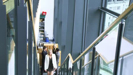 businesswoman and businessman shaking hands in a building footage