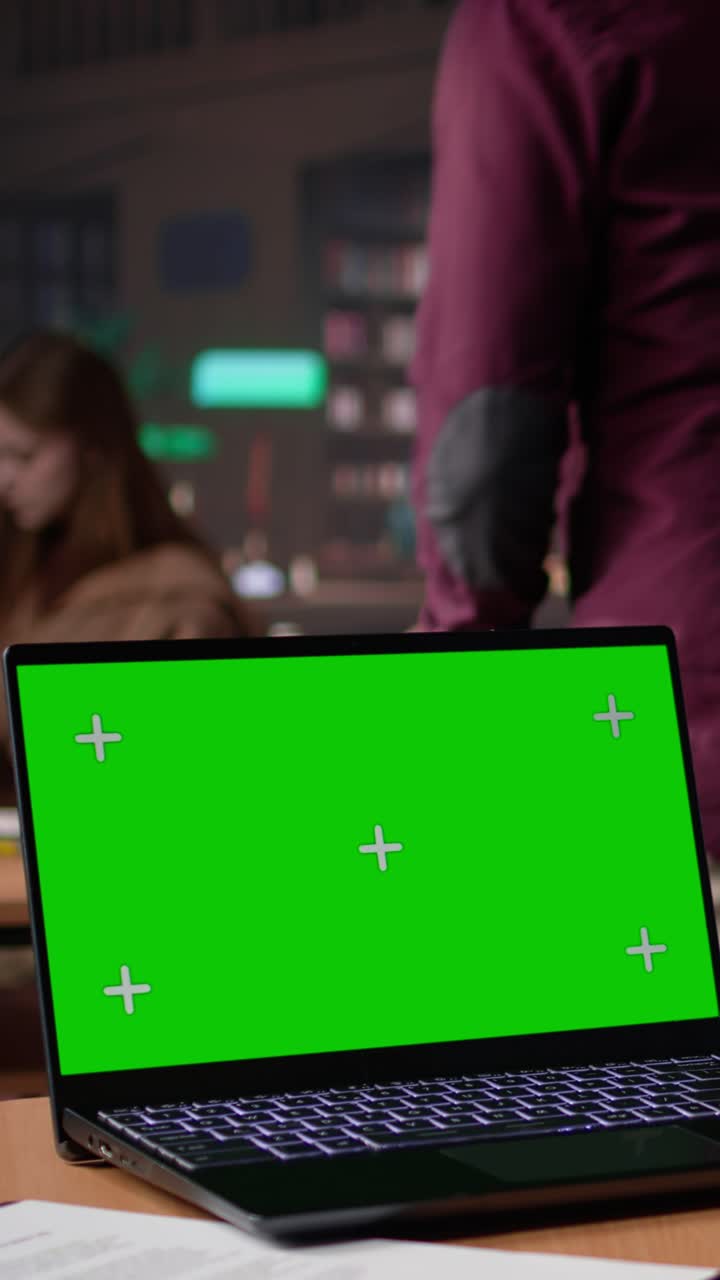 Vertical video african american pupil uses green screen extracting citations from books