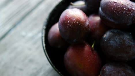 closeup of wet fresh plums