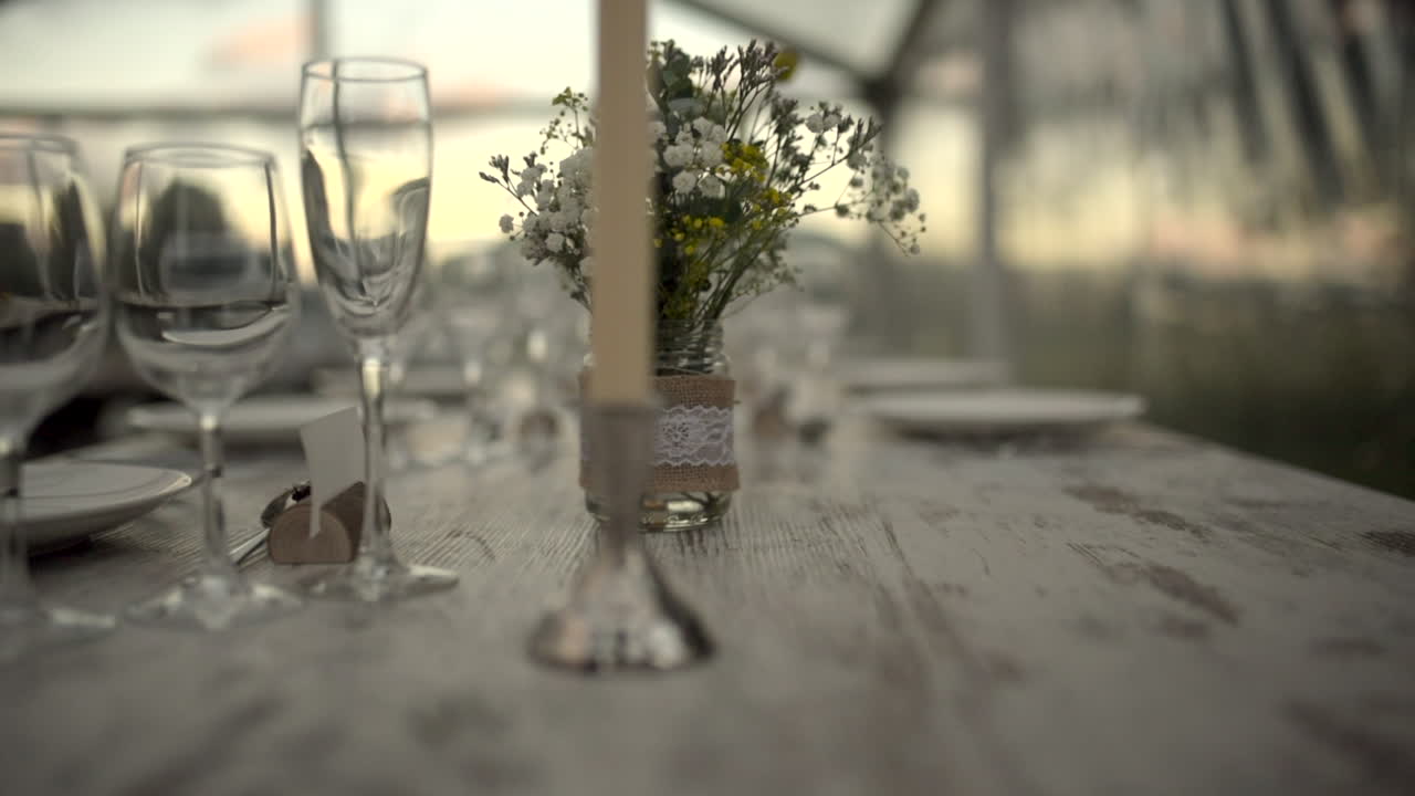 Decorated Table With Wine Glasses And Candle