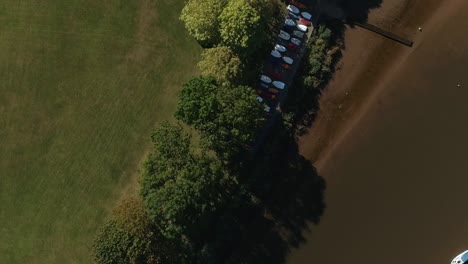top down of a small boat store and jetty on a low tide river