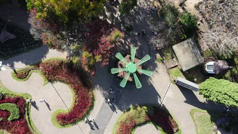 aerial view of buzy plaza with green maze labyrinth in a sunny day