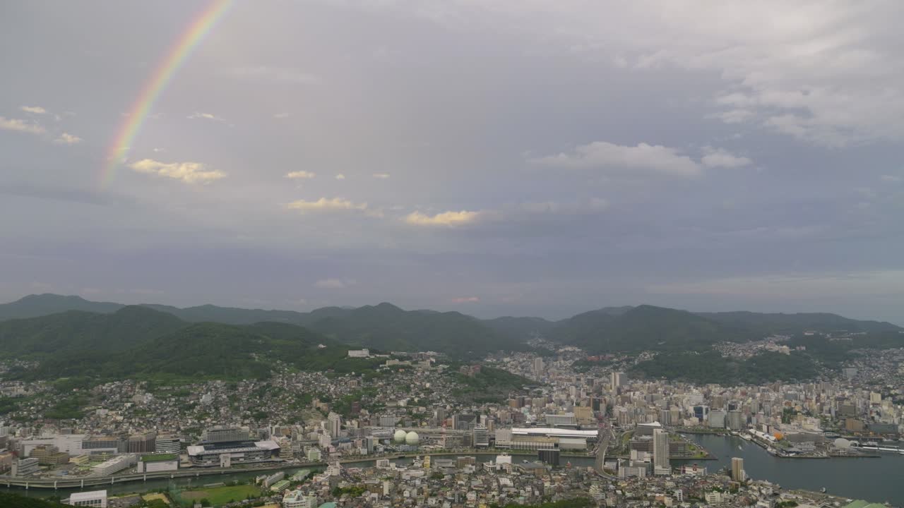 Rainbow over Atomic town of Nagasaki from high above panorama viewpoint
