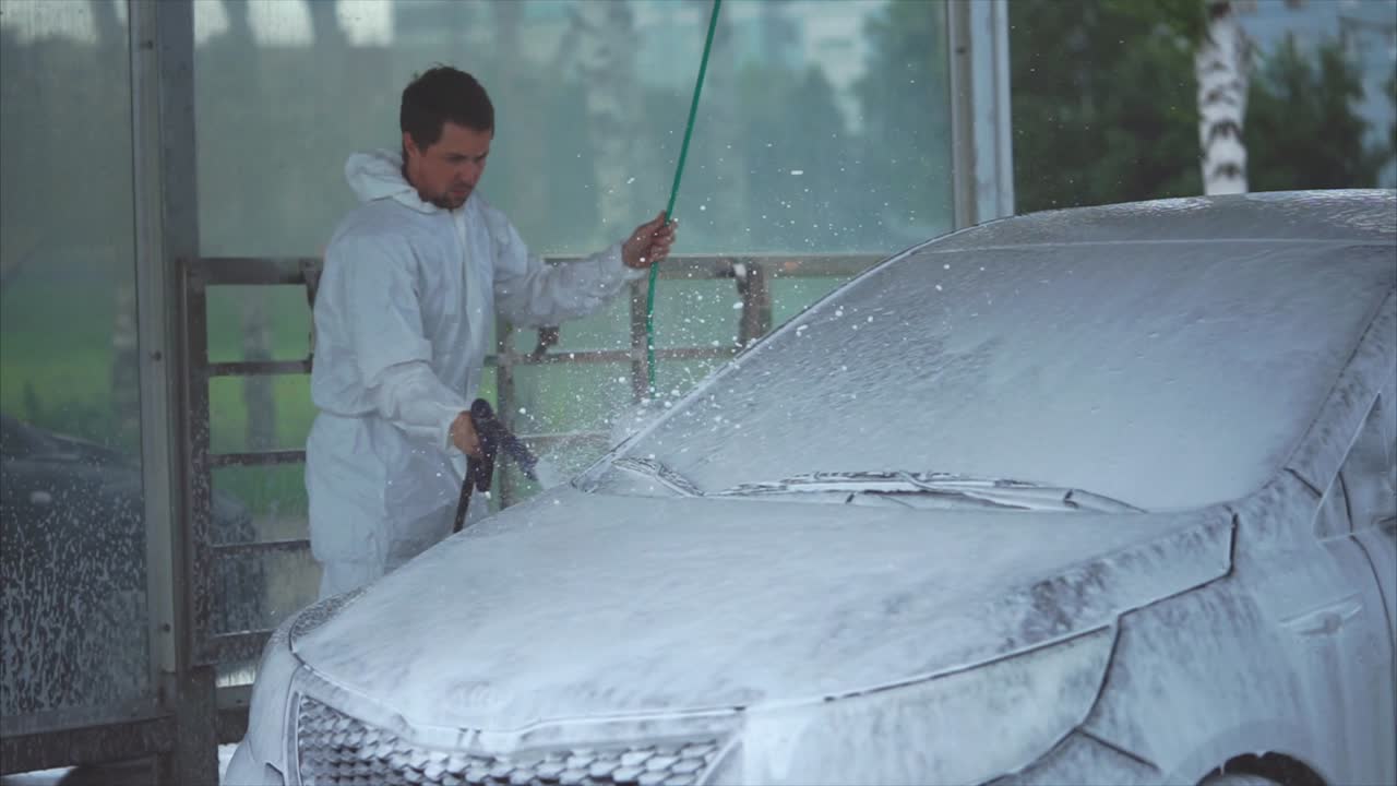 Man Washing Car at Self-Service Car Wash