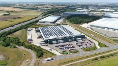 aerial drone footage of large warehouses and logistics center in peterborough england
