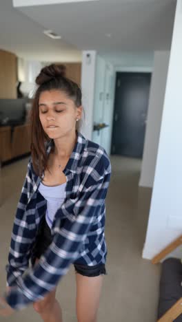 woman dancing in a plaid shirt