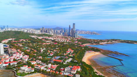 aerial view of coastal city with beach and highrises