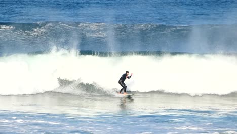 slow motion of a large roundhouse at the most famous surf spot on the portuguese coast, guincho, cascais