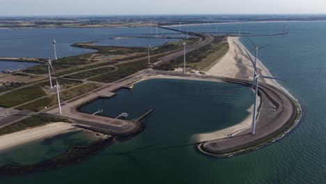 wind turbines at the oosterscheldekering eastern scheldt storm surge barrier. the netherlands. clean energy, wind power, and renewable infrastructure. aerial video