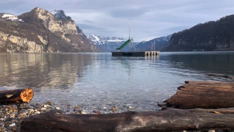 Shore-of-Lake-Walensee,-or-Lake-Walen,-in-Switzerland-Mountains,-Static-Shot