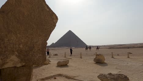 visitors and tourists at the pyramid of menkaure, giza complex of pyramids