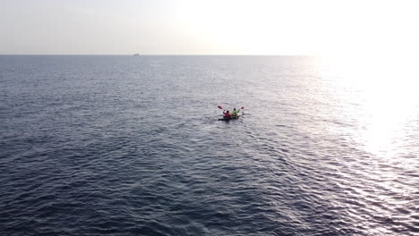 Active-couple-paddling-on-a-kayak-at-sea,-tourists-in-the-Mediterranean-sea