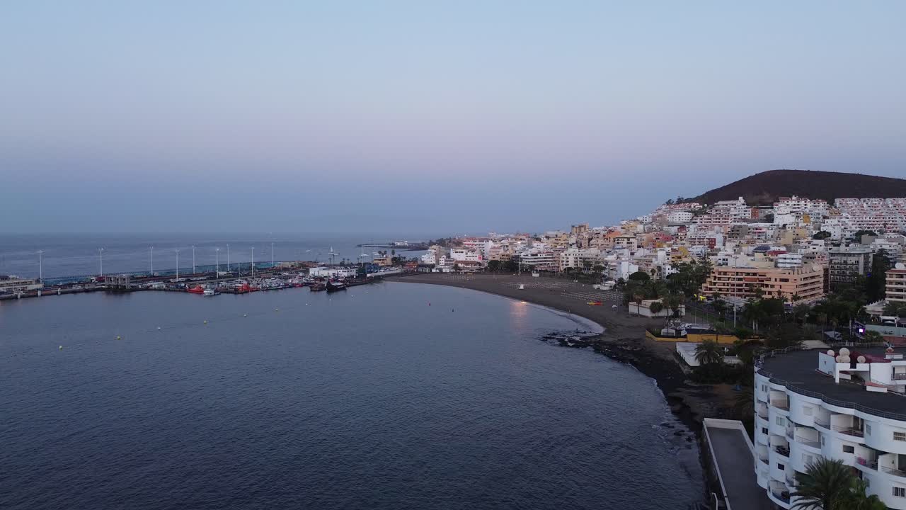 Tenerife Los Cristianos port holiday resort city Canary Islands Spain island aerial drone ocean view