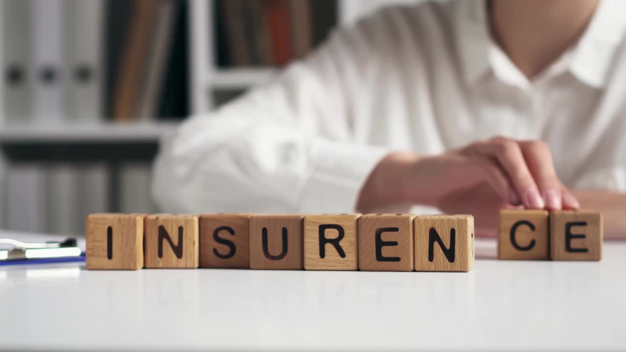 Agent girl hands stacks cubes symbol text sign Insurance. Human life insurance