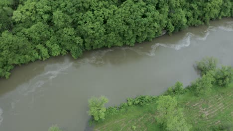Drone-flyover-rolling-curving-river-in-the-midwest-in-the-summer
