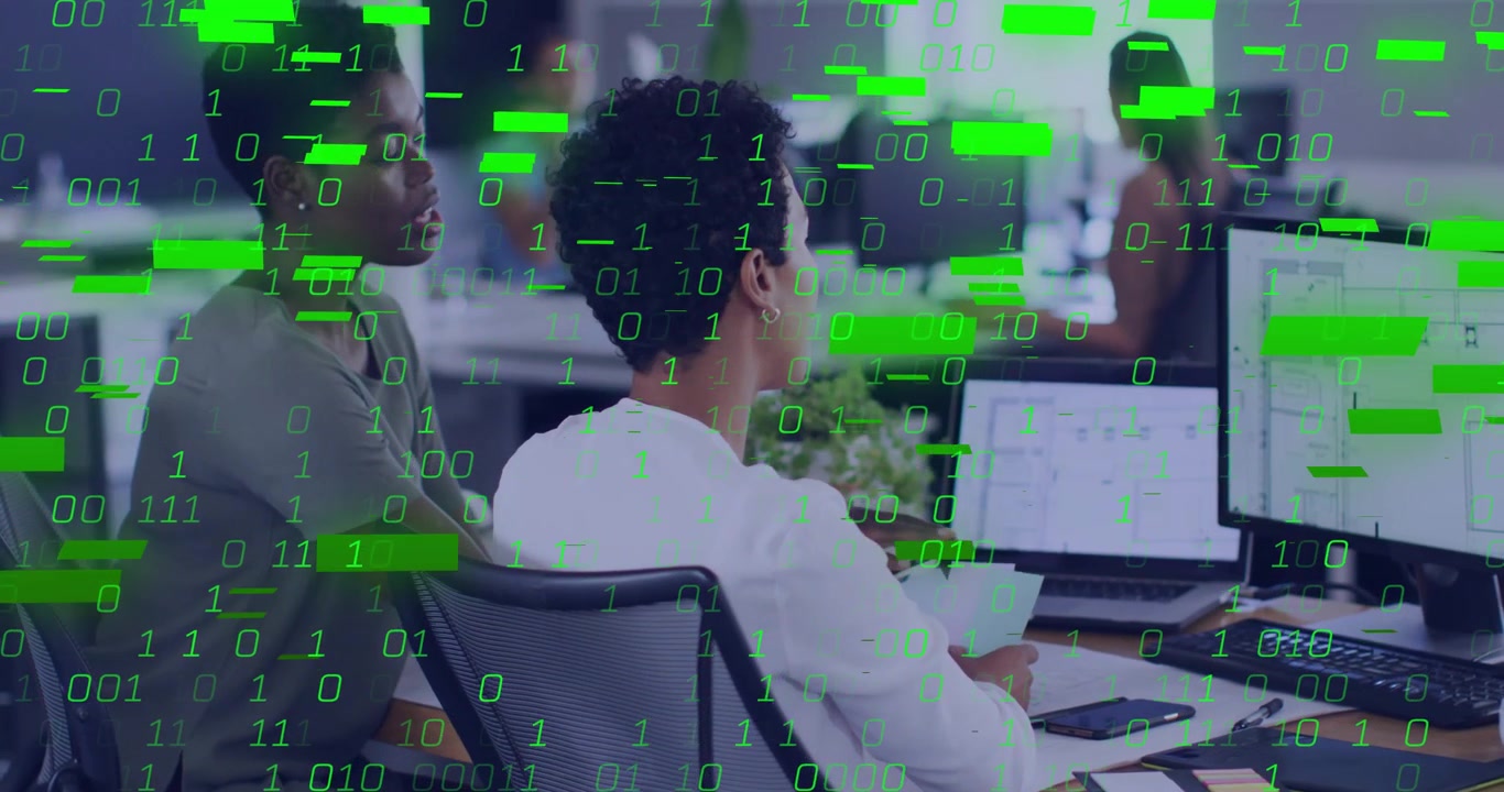 Two analysts scrolling laptop and tapping while visualizing data via binary overlay in tech office