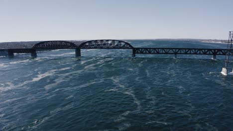 4k fly towards bridge over river drone