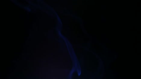 colors smoke in dark background