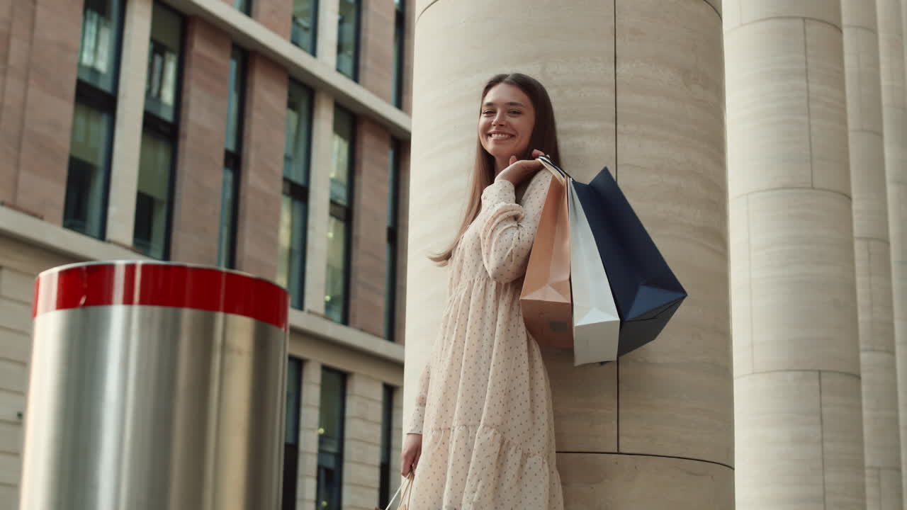 Woman Standing by Pillar after Shopping