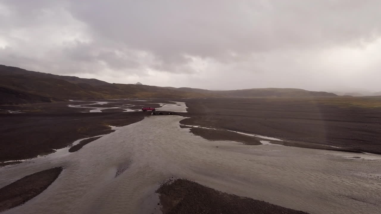 Icelandic River Crossing with Red SUV