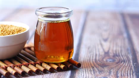 mustard oil in a jar on table