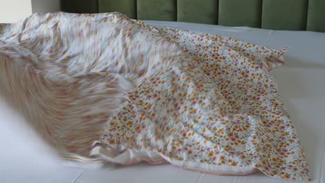 floral bedding on a white bed