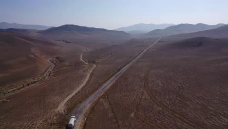 Driving-on-a-narrow-mountain-rocky-road