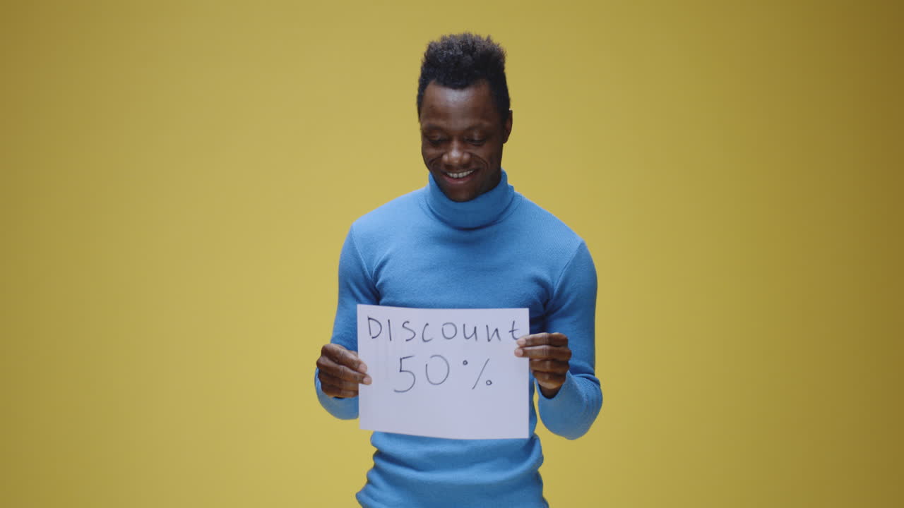 Man Holding 'Discount 50%' Sign with Varying Expressions