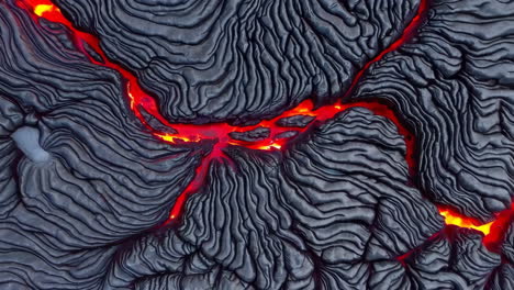 molten lava flowing over solidified lava